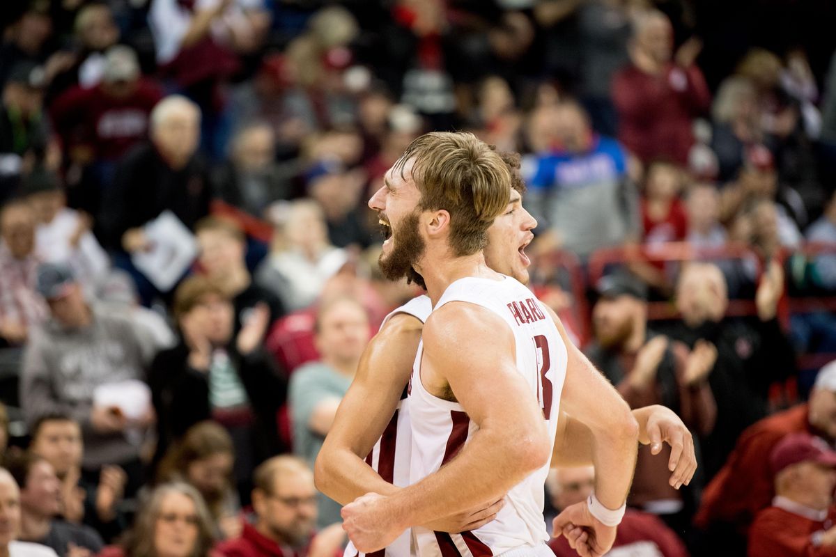 Washington State Cougars forward Jeff Pollard (13) and  forward CJ Elleby (2) react after defeating the New Mexico State Aggies during the second half of a college basketball game on Saturday, December 7, 2019, at Spokane Arena in Spokane, Wash. WSU won the game 63-54. (Tyler Tjomsland / The Spokesman-Review)