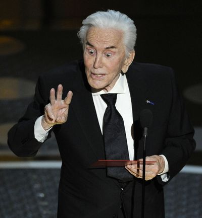 Actor Kirk Douglas presents the award for best supporting actress during the 83rd Academy Awards on Sunday, Feb. 27, 2011, in the Hollywood section of Los Angeles. (AP Photo/Mark J. Terrill) ((AP Photo/Mark J. Terrill) / Associated Press)
