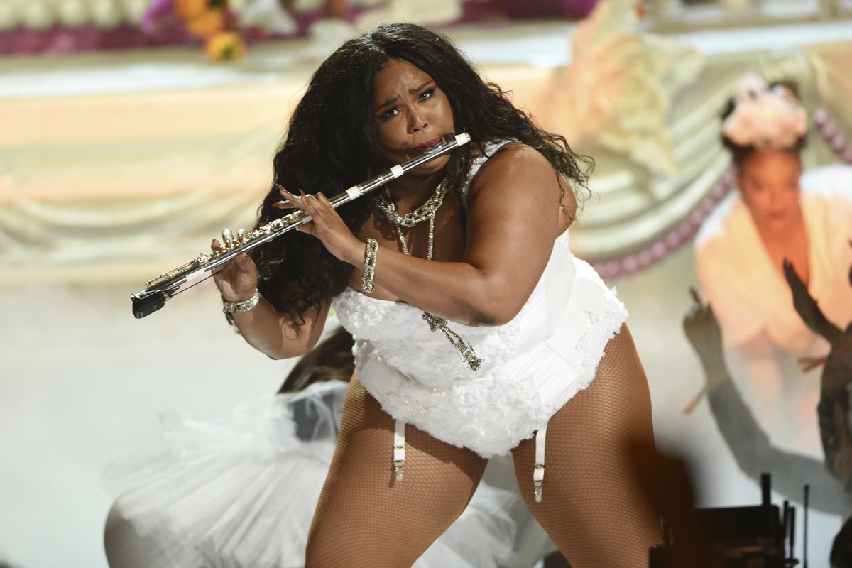 FILE - This June 23, 2019 file photo shows Lizzo playing the flute at the BET Awards in Los Angeles. Billie Eilish and Lizzo, both nominated for the top four prizes at the Grammy Awards, are slated to perform at the Grammy Awards on Jan. 26 event, airing live on CBS. Photo by Chris Pizzello/Invision/AP, File) ORG XMIT: NYET318 (Chris Pizzello / Chris Pizzello/Invision/AP)