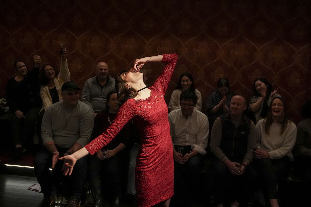 Marissa Chaffee takes a shot of raspberry vodka as she prepares to perform in a boozy "Macbeth." (Jahi Chikwendiu/The Washington Post)
