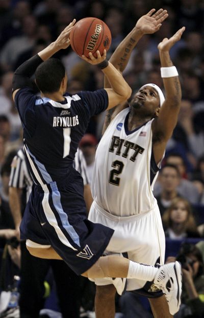 Villanova guard Scottie Reynolds shoots over Pittsburgh’s Levance Fields in victory last weekend. (Associated Press / The Spokesman-Review)