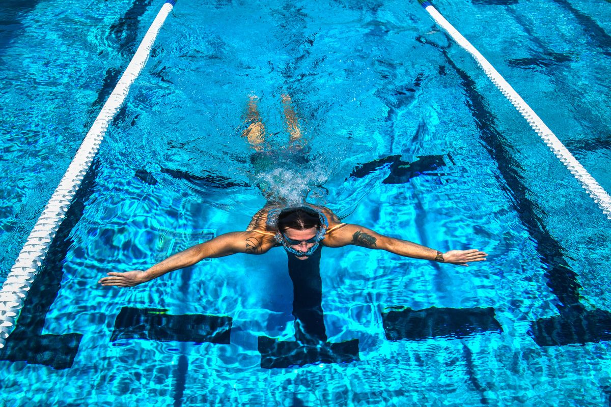 Chris Carter, 27, glides through water to the south end of the Witter Aquatic Center during lap swimming, June 8, 2018. Free swimming at Spokane