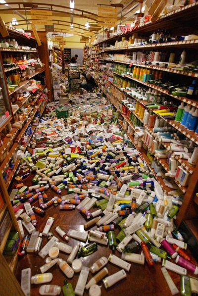 Employees clean up the Eureka Natural Foods store after an earthquake struck Saturday  near Eureka, Calif., north of San Francisco.  (Associated Press)