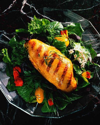 
If you like chicken and enjoy simple recipes, you're going to love this recipe for grilled chicken breasts on the bone. The skin turns out crispy and the meat juicy when rubbed under the skin with Sun-Dried Tomato & Basil, Garlic-Herb or Sage-Butter seasonings listed here.
 (King Features Syndicate / The Spokesman-Review)