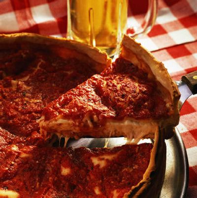 
A midwestern favorite like the pork tenderloin sandwich may be tasty, but can it stack up against a Windy City staple such as deep dish Chicago-style pizza? 
 (Courtesy of PictureArts; Bottom photo courtesy of David Stovall / The Spokesman-Review)