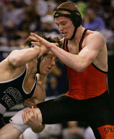 
Bonners Ferry's Adam Hall, left, who eventually won 17-2, makes a move against Priest River's Ryan Miller in the 145-pound title match at the State 3A. 
 (Troy Maben/Special to / The Spokesman-Review)