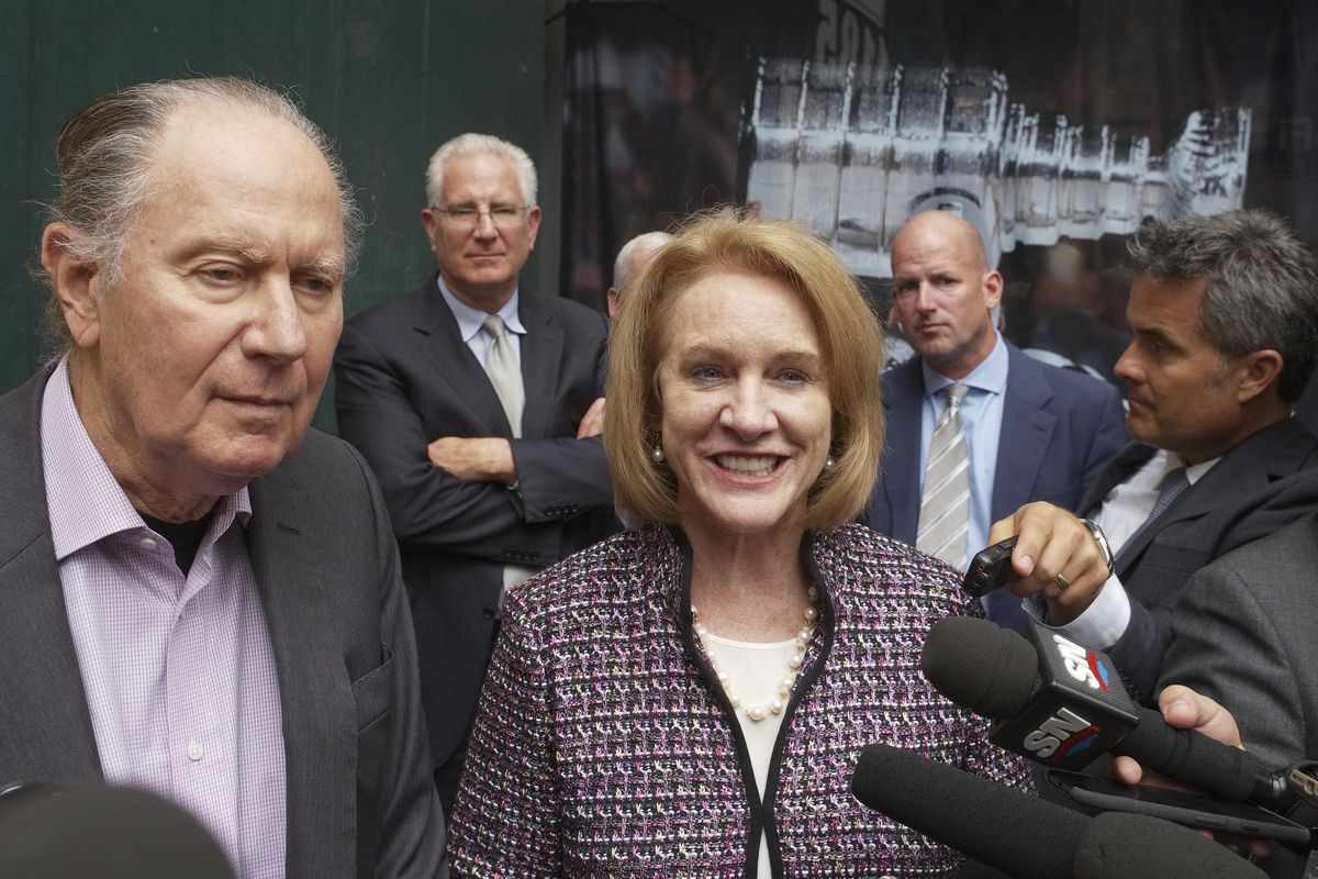 Seattle Hockey Partners’ David Bonderman, left, and Seattle Mayor Jenny Durkan talk to the media as they leave a meeting at National Hockey League headquarters Tuesday in New York. Members of Seattle’s potential ownership group and Durkan presented their case to the Board of Governors’ executive committee at the league office. If the executive committee moves the process forward, the board could vote as soon as December to award the NHL’s 32nd franchise to Seattle. (Mark Lennihan / AP)