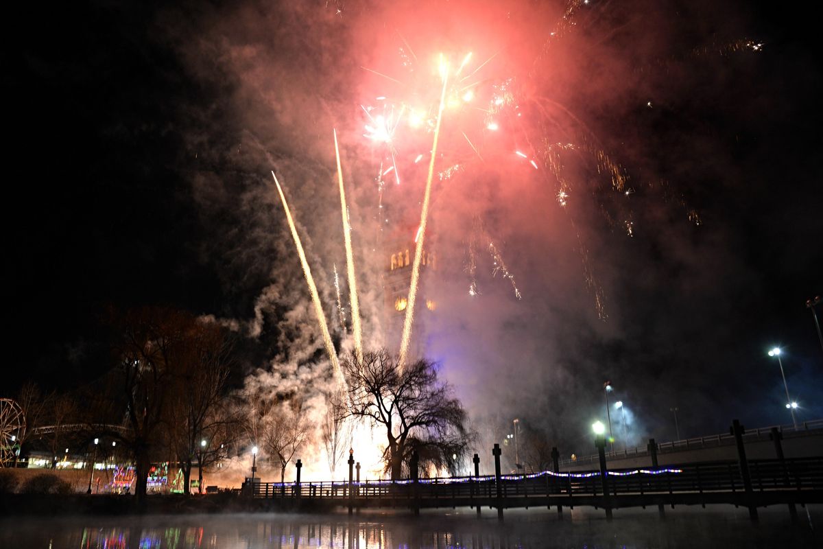 Fireworks explode above the riverfront Park clock Tower Thursday, January 1, 2015. Thousands flocked to the downtown festivities at First Night Spokane. JESSE TINSLEY jesset@spokesman.com (Jesse Tinsley / The Spokesman-Review)