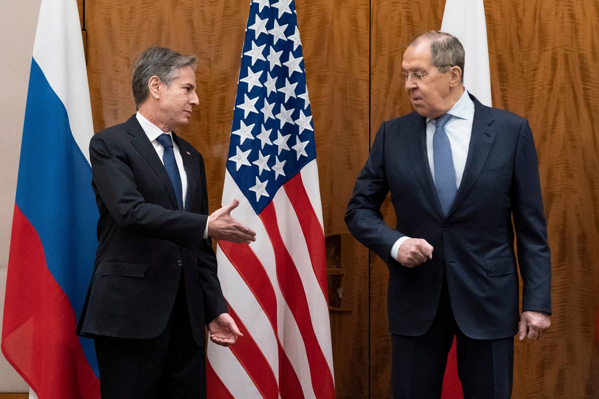 U.S. Secretary of State Antony Blinken, left, greets Russian Foreign Minister Sergey Lavrov before their meeting, in Geneva, Switzerland, Friday, Jan. 21, 2022.  (Alex Brandon)