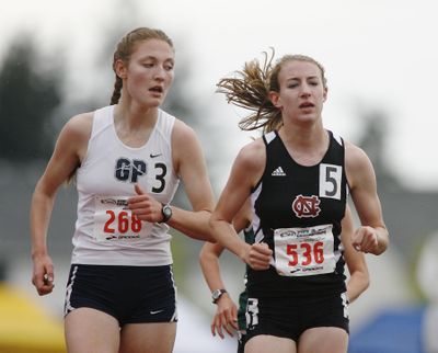 Glacier Peak’s Amy-Eloise Neale, left, keeps her eye on North Central’s Katie Knight in the State 3A girls 3,200 meters. (Patrick Hagerty)