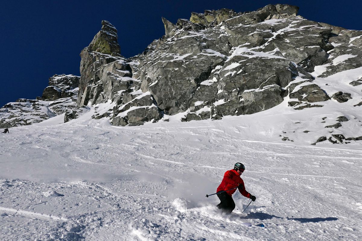 A skier shreds powder on Blackcomb Glacier at Whistler. (John  Nelson / The Spokesman-Review)