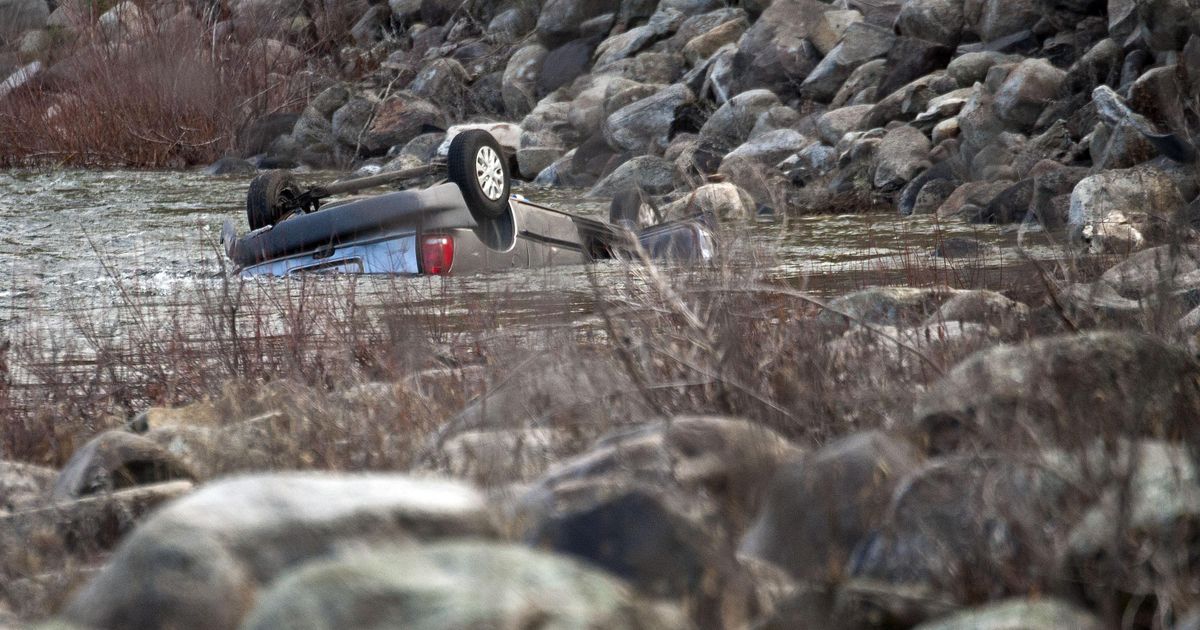 A car that crashed into the Spokane River near Flora Road is photographed on Wednesday, Dec 12, 2018. (Kathy Plonka / The Spokesman-Review)