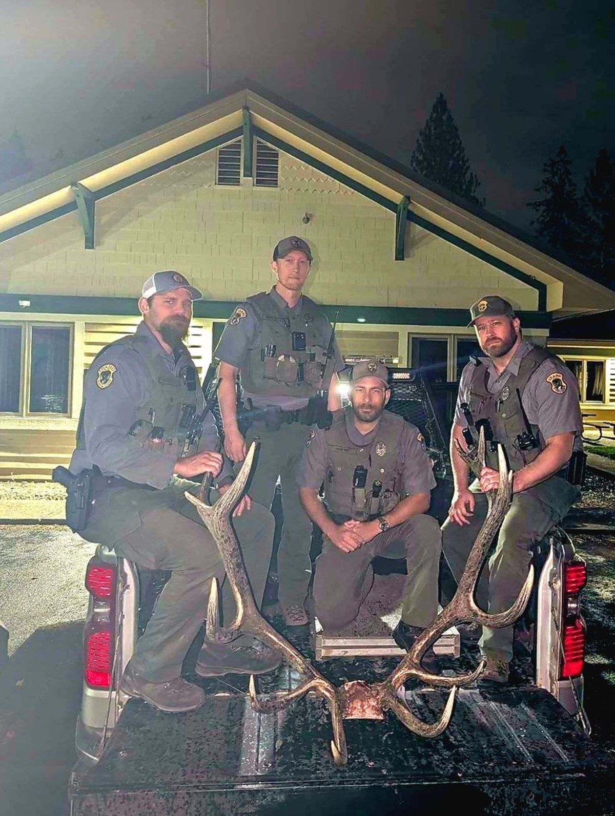 Idaho Department of Fish and Game conservation officers pose with the skull of a bull elk that was killed illegally outside of Coeur d’Alene during September. (Courtesy of Idaho Fish and Game )