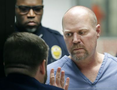 Gregory Bush, right, is arraigned on two counts of murder and 10 counts of wanton endangerment Thursday, Oct. 25, 2018, in Louisville, Ky. Bush is accused of fatally shooting two African-American customers at a Kroger grocery store Wednesday. He was swiftly arrested as he tried to flee, authorities said Thursday. (Scott Utterback / Associated Press)