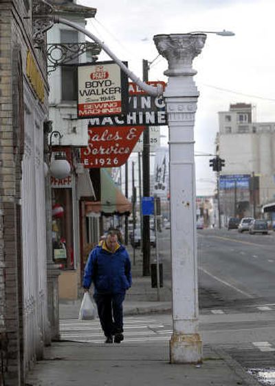 A pillar sits on the sidewalk at the southeast corner of Napa Street and Sprague Avenue and is connected to the building by a pipe. It is believed to have supported a clock rather than a globe or lamp.
(Dan Pelle / The Spokesman-Review)