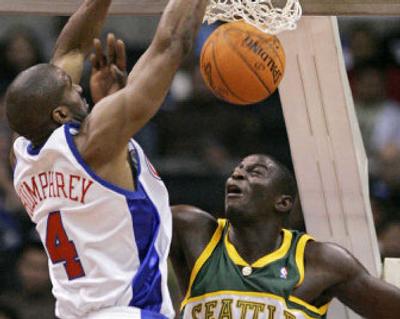 
Ryan Humphrey of the Los Angeles Clippers dunked on new SuperSonics center Mouhamed Sene in a preseason game. 
 (Associated Press / The Spokesman-Review)