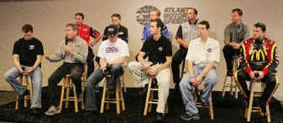 
Members of the Hendrick Motorsports team listen as Terry Labonte, second from left, speaks at a press conference.
 (Associated Press / The Spokesman-Review)