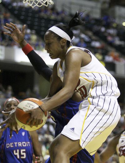 Briann January grabs a rebound in last Saturday’s win in which she had a WNBA career-high of 17 points.  (Associated Press / The Spokesman-Review)