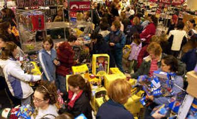 
Customers swarm around the toy department as they take advantage of the early bird specials at Kohl's department store in Taylor, Mich.
 (Associated Press / The Spokesman-Review)