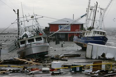 Shrimp boats rest in the parking lot of the Pass Christian, Miss., harbor after Hurricane Gustav’s storm surge swept through coastal Mississippi on Monday. (Associated Press / The Spokesman-Review)