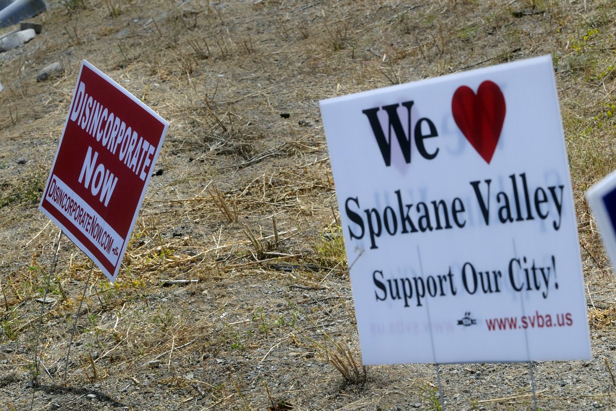 An increasing number of signs in yards and vacant lots indicates the broad divide among residents for and against a proposal to dissolve Spokane Valley city government. Supporters hope to collect enough signatures to allow voters to decide the issue by ballot. (J. BART RAYNIAK / The Spokesman-Review)