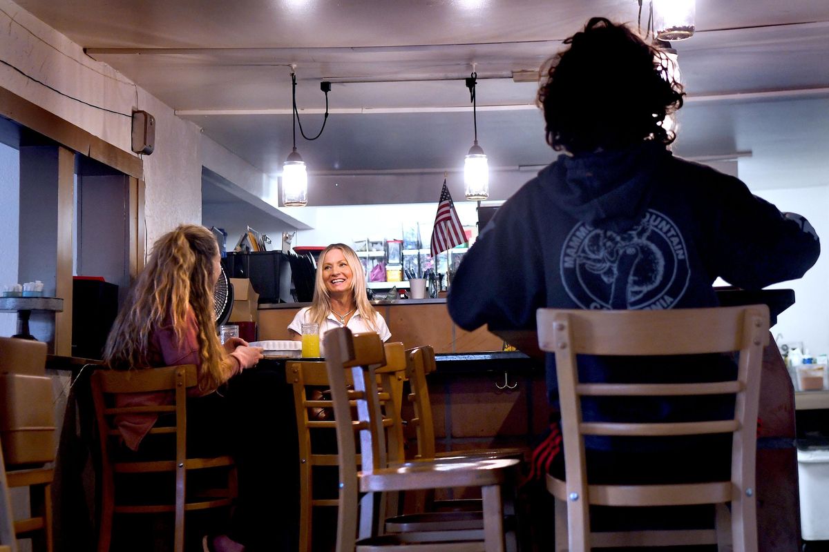 Waitress Pamela Kirchgassner, center, talks with Kathleen Capone at the Garnet Cafe in Coeur d