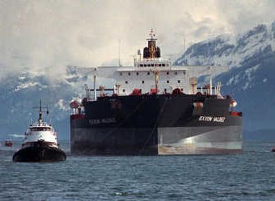 
Tugboats pull the crippled tanker Exxon Valdez toward Naked Island in Prince William Sound, Alaska, in 1989. The Supreme Court will decide whether Exxon will have to pay $2.5 billion in damages in connection to the 1989 oil spill along the Alaskan coastline.Associated Press
 (FILE Associated Press / The Spokesman-Review)
