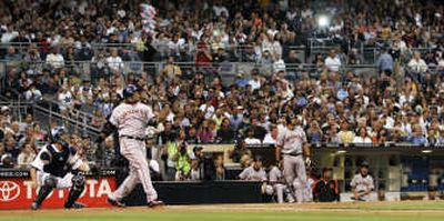 
San Francisco's Barry Bonds watches the flight of his 755th home run during the second inning of Saturday's game at San Diego. Bonds is now tied with Hank Aaron for first on the all-time home run list.Associated Press
 (Associated Press / The Spokesman-Review)