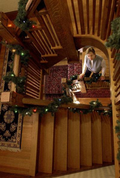 
The impressive staircase of her restored 1911 Cannon Hill area bungalow frames owner Kathy Chase. The staircase was featured in the book, 
