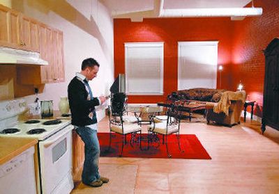 
Jonathan Smith, who returned to Spokane after living in the Bay Area, stands in his downtown condominium.  
 (Holly Pickett/the spokesman-review / The Spokesman-Review)