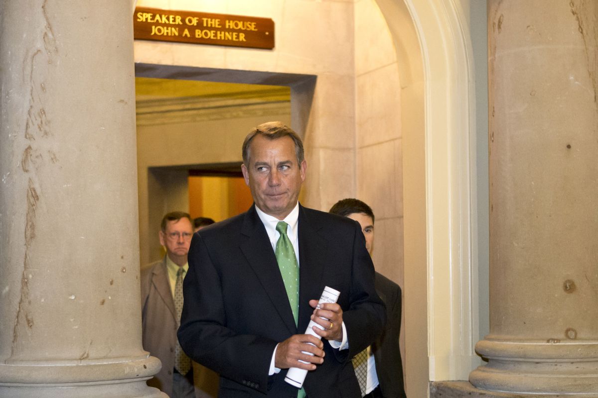 House Speaker John Boehner of Ohio leaves his office and walks to the House floor to deliver remarks about negotiations with President Obama on the fiscal cliff, Tuesday, Dec. 11, 2012, on Capitol Hill in Washington. (J. Applewhite / Associated Press)