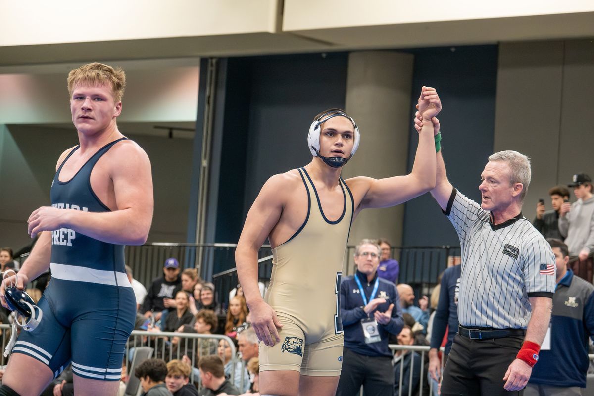 Mead’s Ethan Harvey celebrates his victory during the District 6 4A boys wrestling tournament on Saturday, February 7, 2026, at the Spokane Convention Center in Spokane, Washington.  (Madison McCord/For The Spokesman-Review)