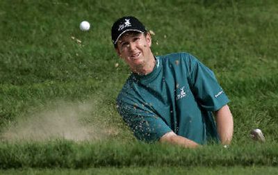 
J.J. Henry hits from a trap during the Buick Championship. 
 (Associated Press / The Spokesman-Review)