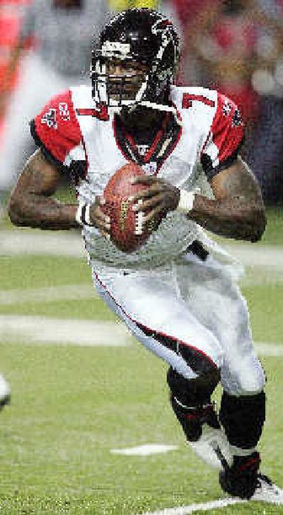 
Elusive Atlanta Falcons quarterback Michael Vick directs the No. 1 rushing offense in the NFL. 
 (File/Associated Press / The Spokesman-Review)