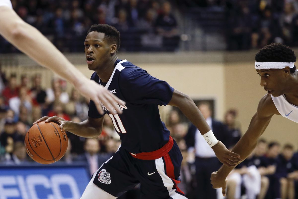 Gonzaga guard Joel Ayayi dribbles the ball during the first half of the team