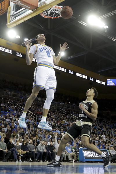 UCLA guard Lonzo Ball celebrates after scoring as Western Michigan guard Bryce Moore watches during the second half of an NCAA college basketball game in Los Angeles, Wednesday, Dec. 21, 2016. UCLA won 82-68. (AP Photo/Chris Carlson) ORG XMIT: CACC112 (Chris Carlson / AP)