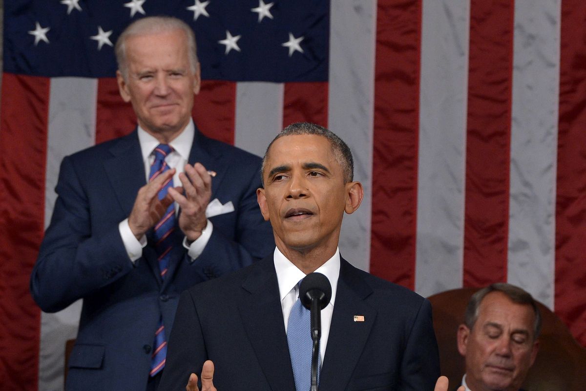 President Barack Obama delivers his State of the Union address as Vice President Joe Biden applauds and House Speaker John Boehner listens. (Associated Press)
