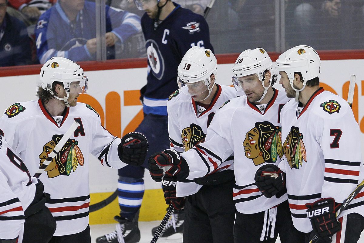 From left, Blackhawks Duncan Keith, Jonathan Toews, Patrick Sharp and Brent Seabrook celebrate a goal. (Associated Press)
