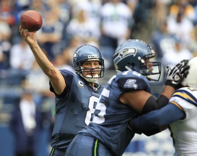 Seattle lineman Sean Locklear, right, and quarterback Matt Hasselbeck have struggled on offense this season. (Associated Press)