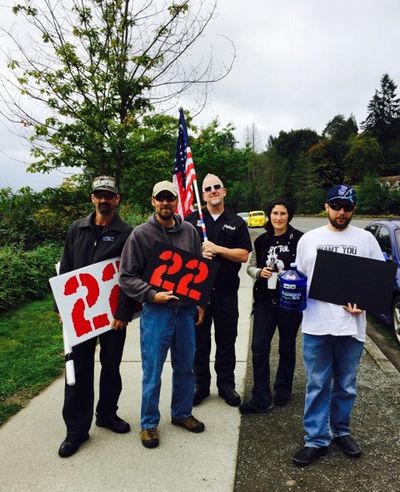 Patrick Seifert, holding flag, created Twenty 22MAny, a nonprofit that helps veterans with PTSD and raises awareness of suicide risk. (Courtesy Twenty22Many)