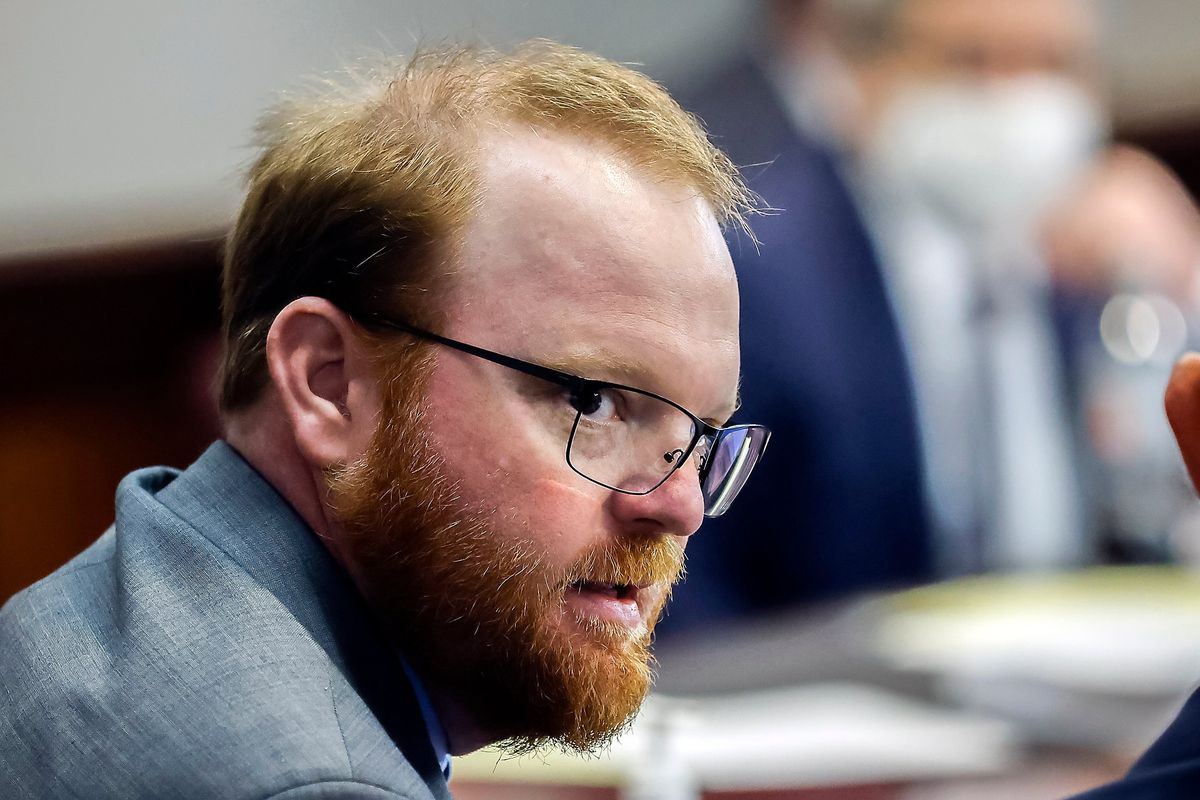 FILE - Travis McMichael is shown during the sentencing of he and his father Greg McMichael and neighbor, William "Roddie" Bryan in the Glynn County Courthouse, Friday, Jan. 7, 2022, in Brunswick, Ga. The man who fatally shot Ahmaud Arbery and his father have reached a plea deal that could avoid their trial on federal hate crime charges. Arbery's parents denounced the deal as a betrayal, and called on the judge to reject it. Court documents filed late Sunday, Jan. 30, 2022, by prosecutors for the U.S. Justice Department say plea agreements were reached with Travis and Greg McMichael.  (Stephen B. Morton)