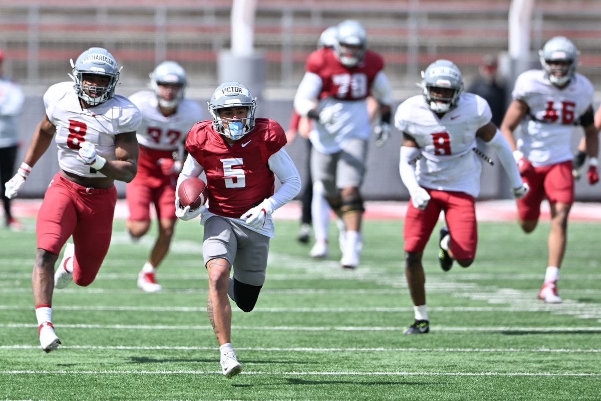 Washington State slot receiver Lincoln Victor (5) runs for a 69-yard touchdown after making a short reception during a scrimmage Saturday at Gesa Field in Pullman.  (Tyler Tjomsland/The Spokesman-Review)