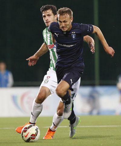 Zalgiris’ Samir Kerla, left, and Malmo’s Magnus Eikrem challenge for the ball during the Champions League, second qualifying round soccer match between the Zalgiris and Malmo at the LFF stadium in Vilnius, Lithuania, Tuesday, July 21, 2015. (Mindaugas Kulbis / Associated Press)