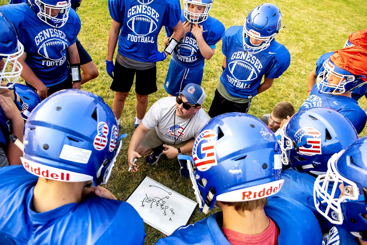 Assistant head coach Matt Jutilla goes over plays with the team at the Genesee football practice on Wednesday.  (August Frank/Courtesy of Lewiston Tribune)