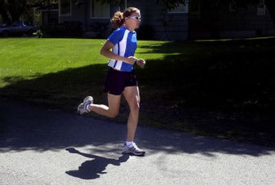 
Annie Warner goes for a midday run in her Spokane Valley neighborhood. Warner trains all year-round to compete in triathlons.
 (Photos by Liz Kishimoto/ / The Spokesman-Review)
