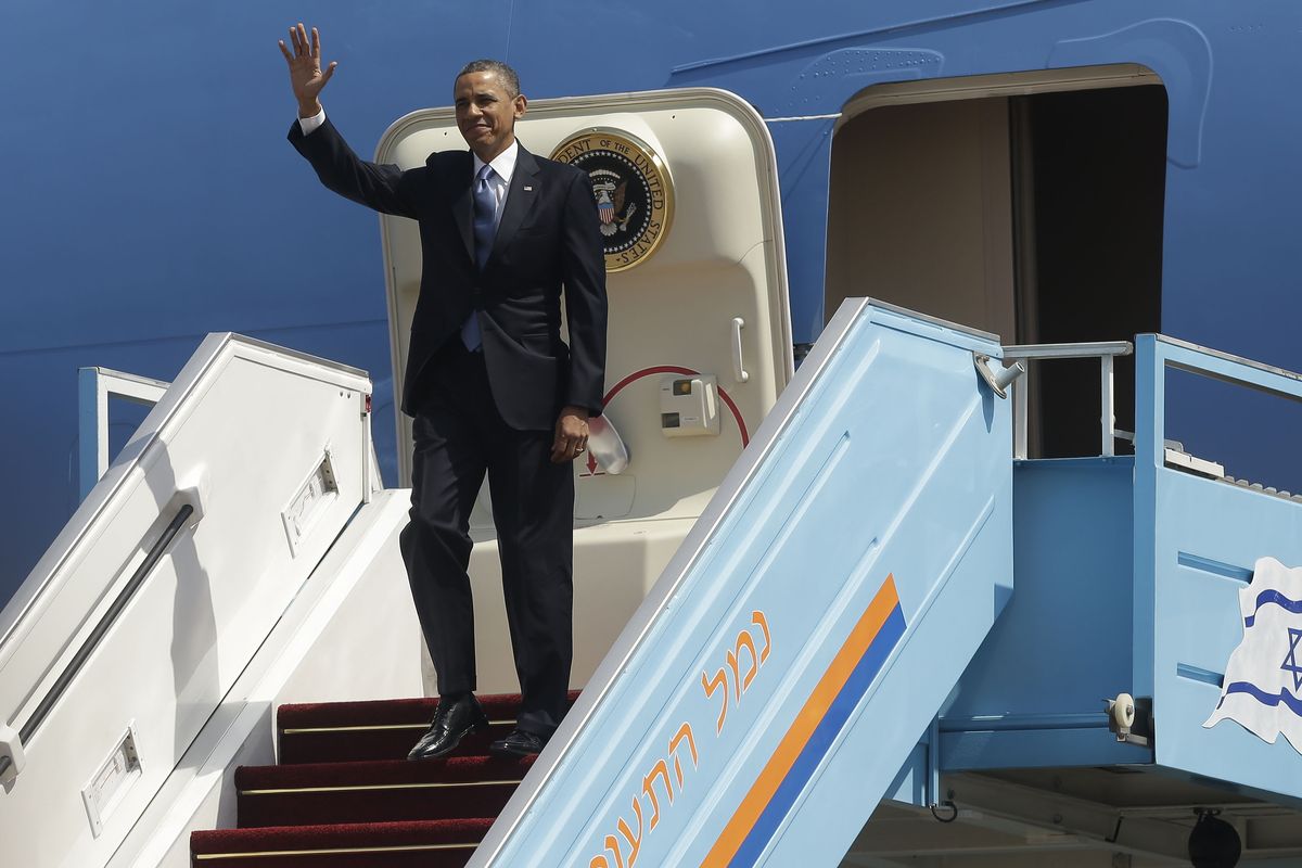President Barack Obama waves as he steps off Air Force One upon his arrival at Ben Gurion International Airport in Tel Aviv, Israel, Wednesday, March 20, 2013, (Pablo Monsivais / Associated Press)