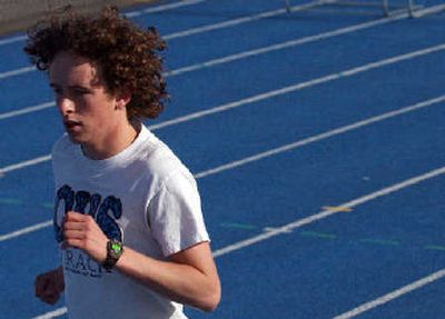 Coeur d'Alene distance ace Michael Armon sprints during Tuesday's practice.
(Kathy Plonka / The Spokesman-Review)