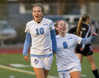 Central Valley sophomore Kelsey Turnbow, left, is congratulated by teammate Kaelyn Barnes after scoring the first goal in the 4A girls state soccer championship game Saturday in Puyallup, Wash. The Bears defeated Jackson 5-2 and claimed its second consecutive state title. Turnbow, who scored three goals, was named player of the year.