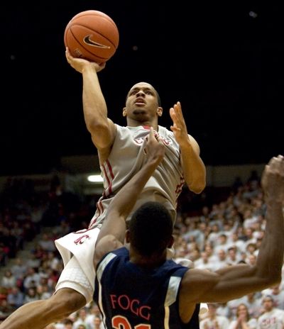 The status of WSU guard Reggie Moore is still up in the air for tonight’s game. (Associated Press)