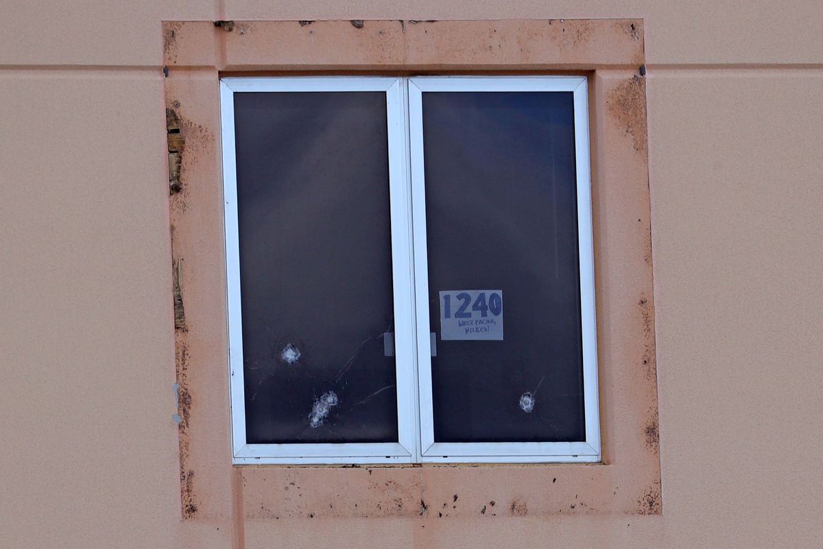 A sign reading "1240 west facing window" and five bullet holes can be seen in a third-floor window of the 1200 building, the crime scene where the 2018 shootings took place at Marjory Stoneman Douglas High School in Parkland, Florida. (Amy Beth Bennett/South Florida Sun Sentinel/TNS)  (Amy Beth Bennett/Sun Sentinel/TNS)
